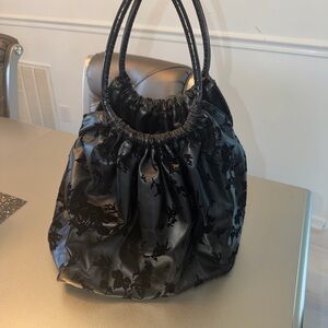 RED Valentino Black Floral Patent Drawstring Shoulder Bag